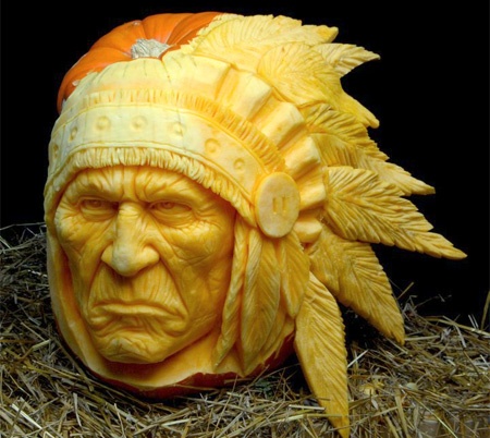 Pumpkin carved into a Native American chief with a headdress Pumpkin carved into a Native American chief with a headdress