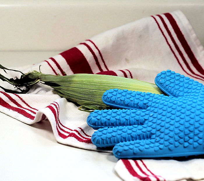 Hot microwaved corn and silicone gloves