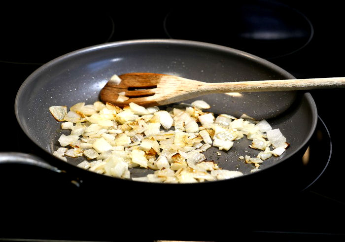 Cooking onions and garlic in a pan