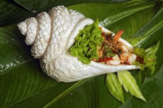 vegetable carving of a seashell filled with food vegetable carving of a seashell filled with food