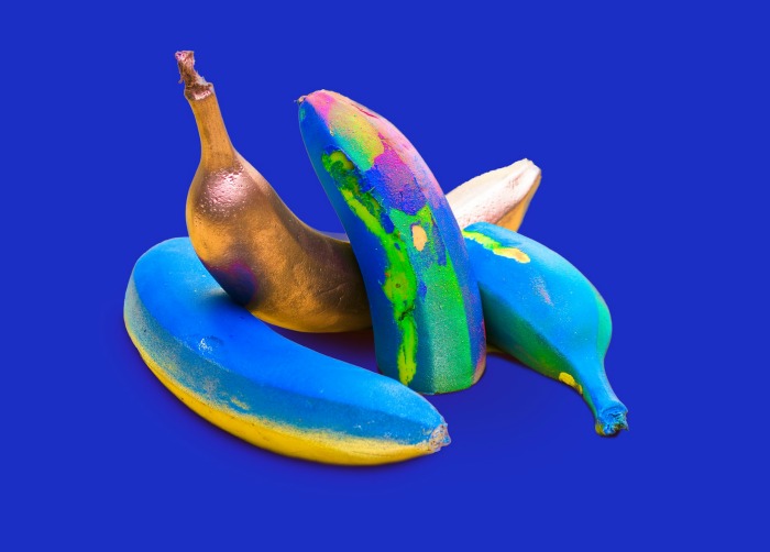 Colorful banana still life made with bright paint colors.