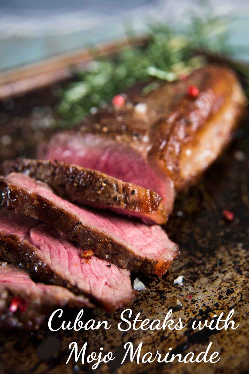 Grilled steak with words Cuban Steaks with Mojo Marinade.