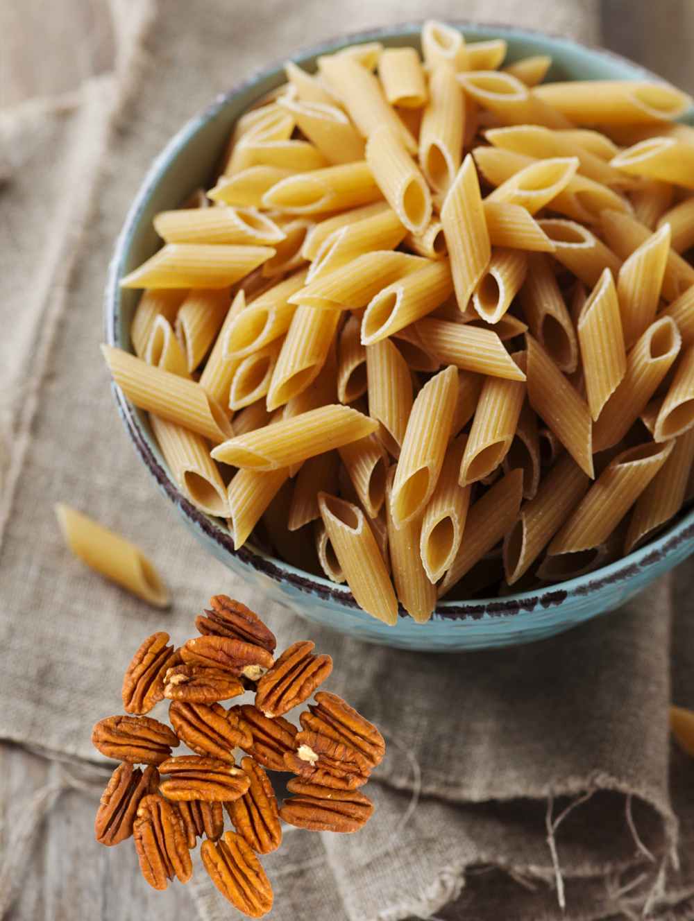Whole wheat penne pasta and pecans.
