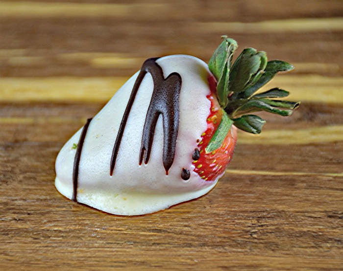 white chocolate strawberries with a dark chocolate drizzle