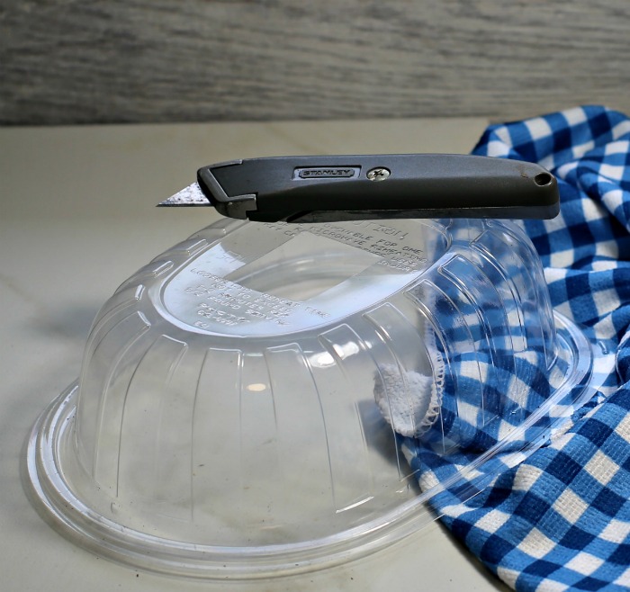 Use a sharp knife to vent the top of the rotisserie chicken container