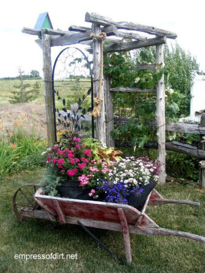 Wheel barrow planter and wooden arbor!
