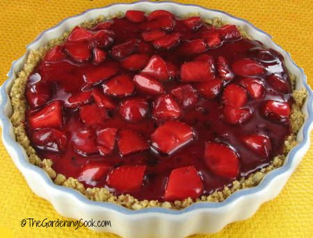 Strawberry almond cheesecake with a glazed topping.