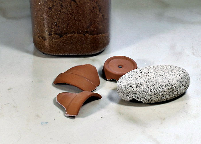pieces of terra cotta and a pumice stone