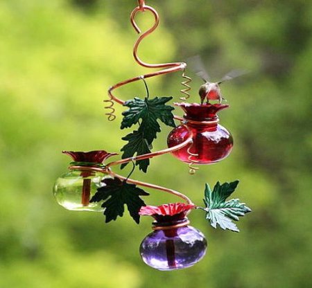 Glass and Copper Humminggbird feeder with leaves