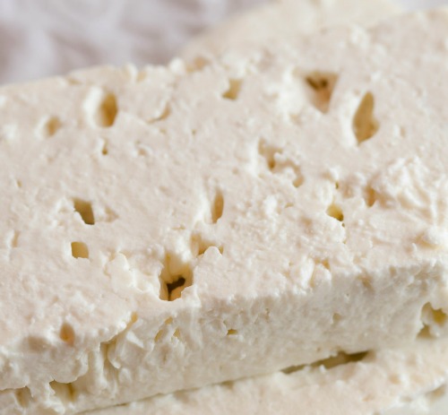 mash feta cheese with a potato masher
