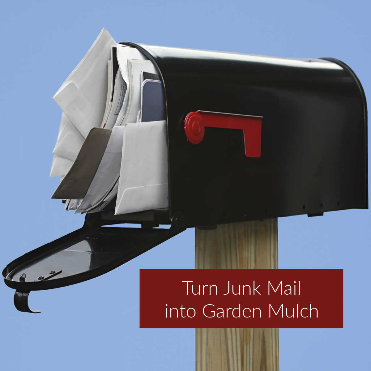 Mailbox filled with junk mail and words Use junk mail for garden mulch.