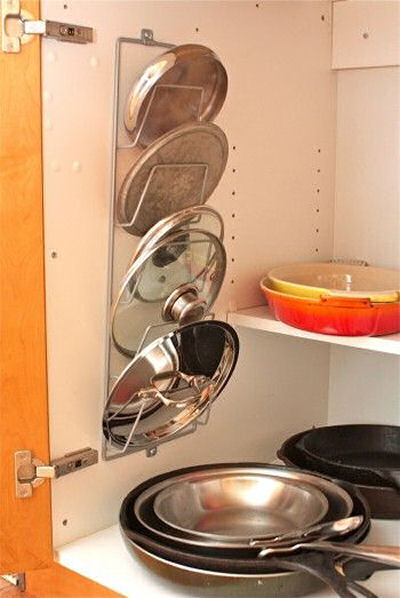 Using a Magazine rack on the inside of cupboard to store pot holders