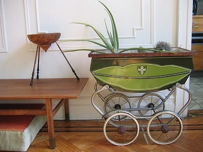Old baby pram used as a planter