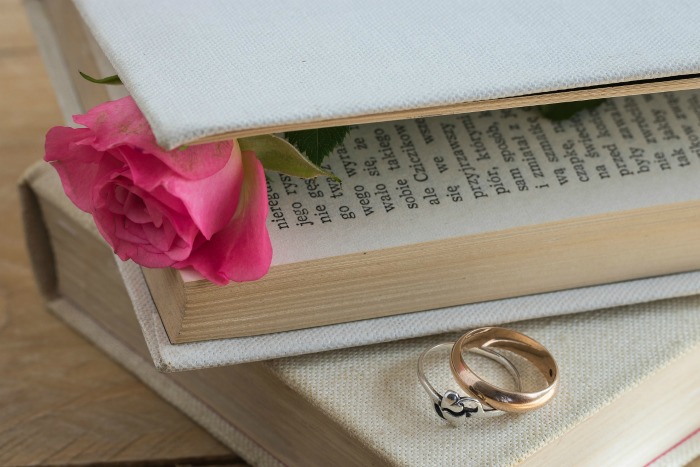pressing roses in a book.