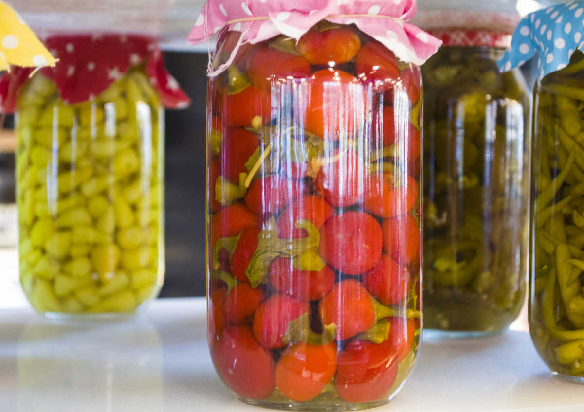 Canned vegetables in glass jars.