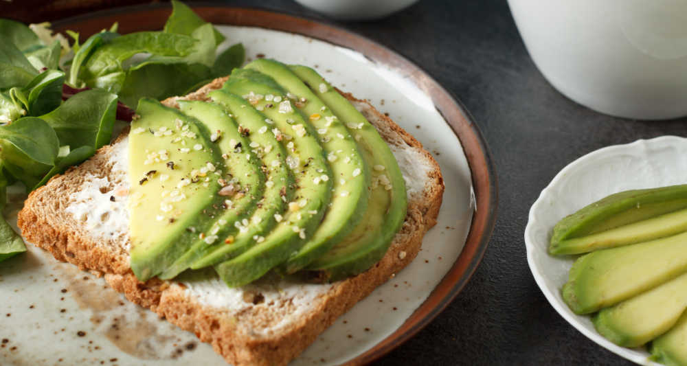Slices of Florida avocado on a piece of bread.