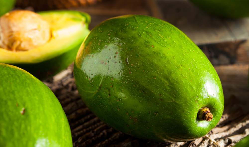 Florida avocado whole and cut in half.