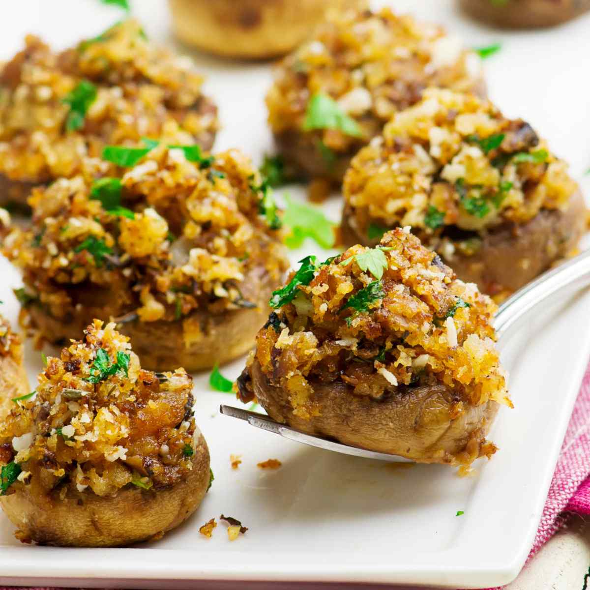 Stuffed mushrooms on a white plate.