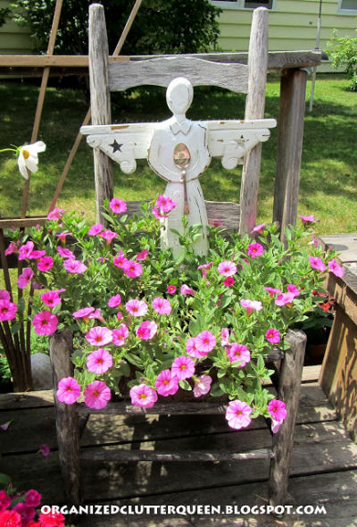 Angel and spoon grace this weathered garden chair.