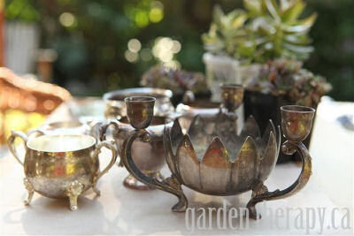 Creative garden planters - vintage silver pots.