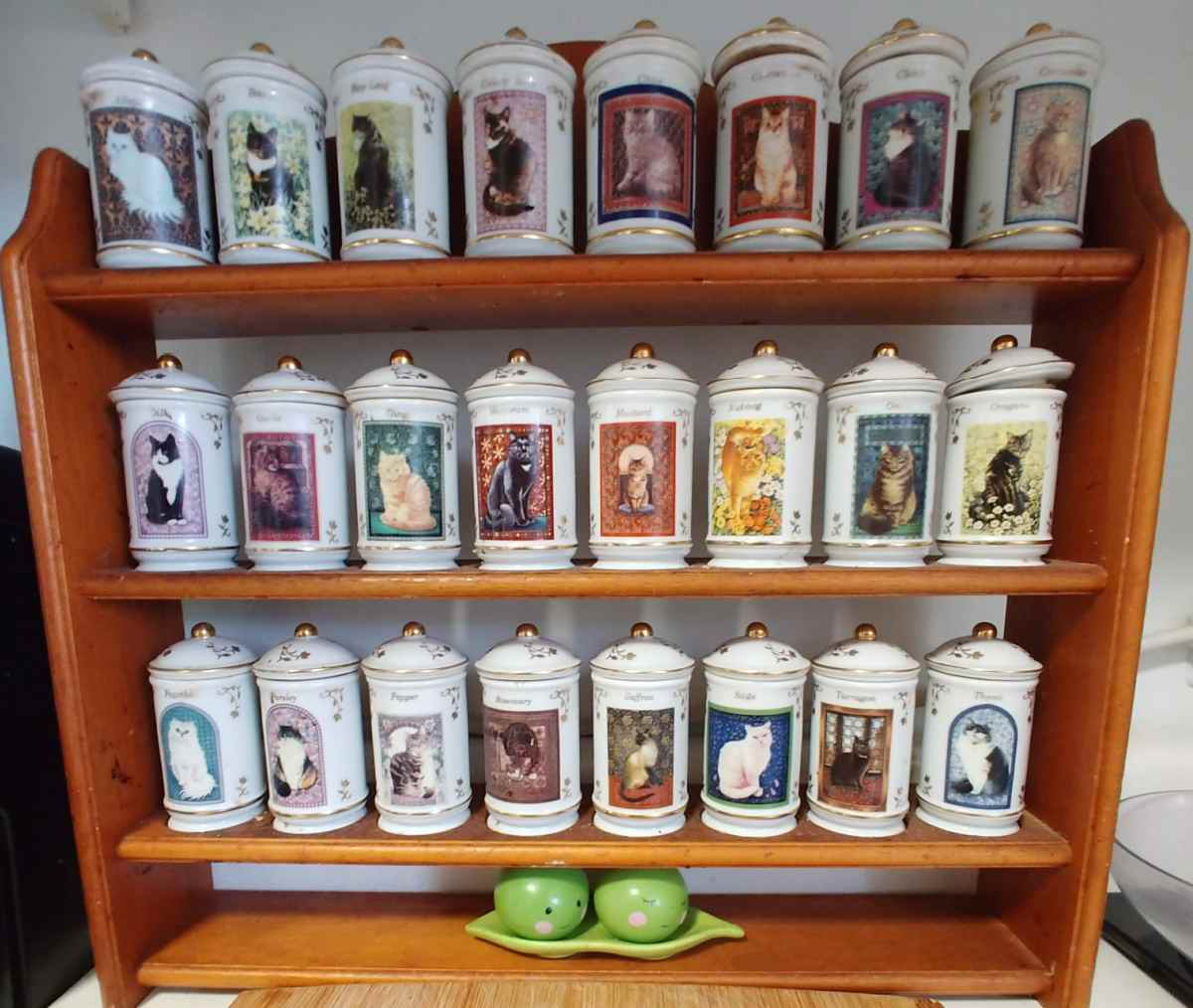 Lenox Cats of Distinction spice jars in a wooden rack.
