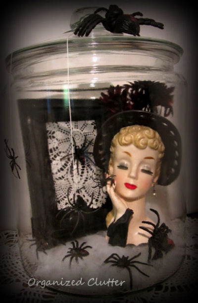 Dress up a vintage lady head vase with spiders for Halloween