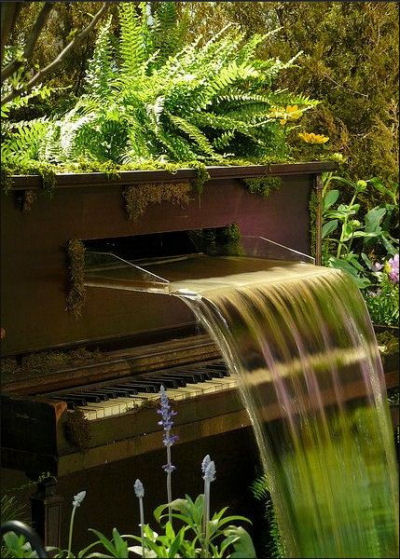 Player piano turned into a garden water feature
