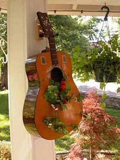 Guitar used as a container for plants