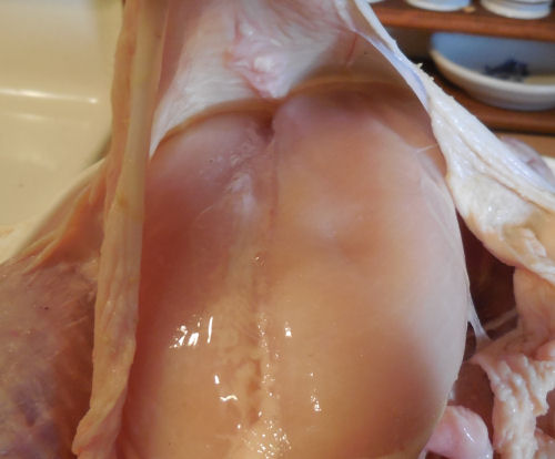 Separate the skin from the chicken.