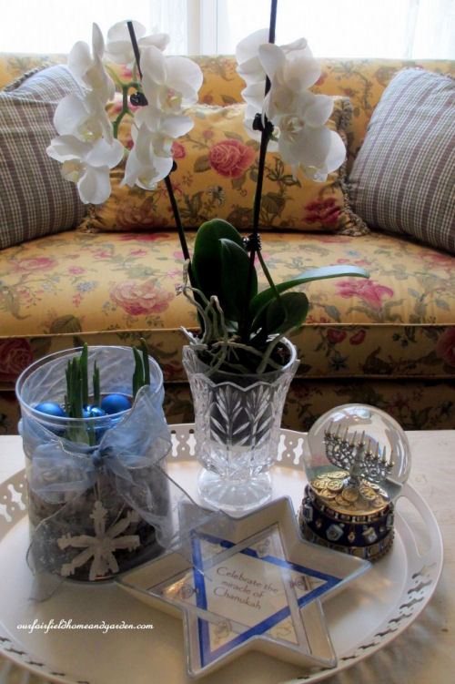 Table decor with Channukah decorations and paperwhites from ourfairfieldhomeandgarden.com