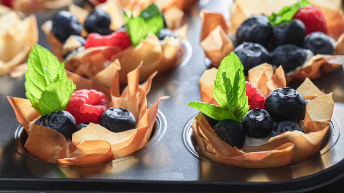 Blueberry and raspberry fruit tarts in phyllo shells.
