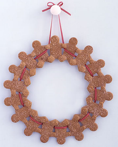 Gingerbread Man Christmas wreath from marthastewart.com on a white door.