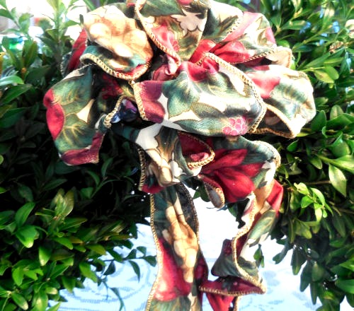 Add a large bow made with wire edged ribbon