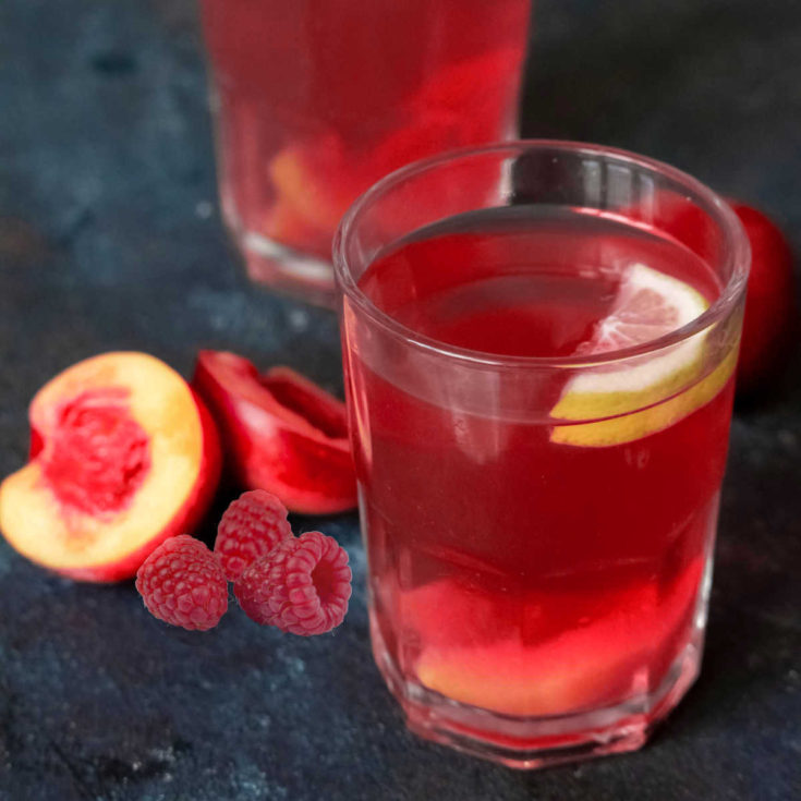 Berry bellinis with peaches and raspberries.