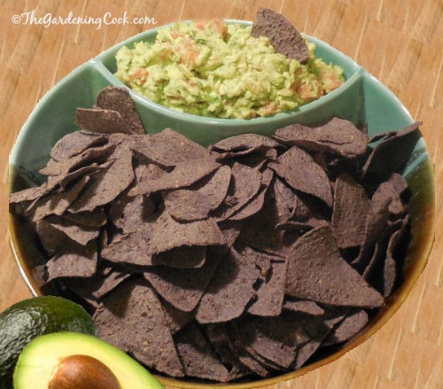 Best Ever Guacamole with dark tortilla chips