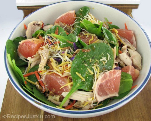 Citrus salad with chicken, walnuts and grapefruit