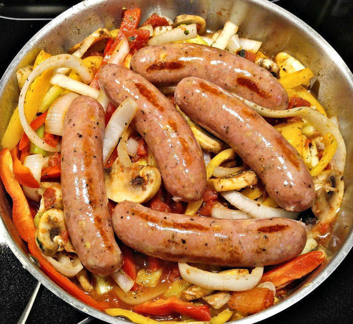Sausages over vegetables