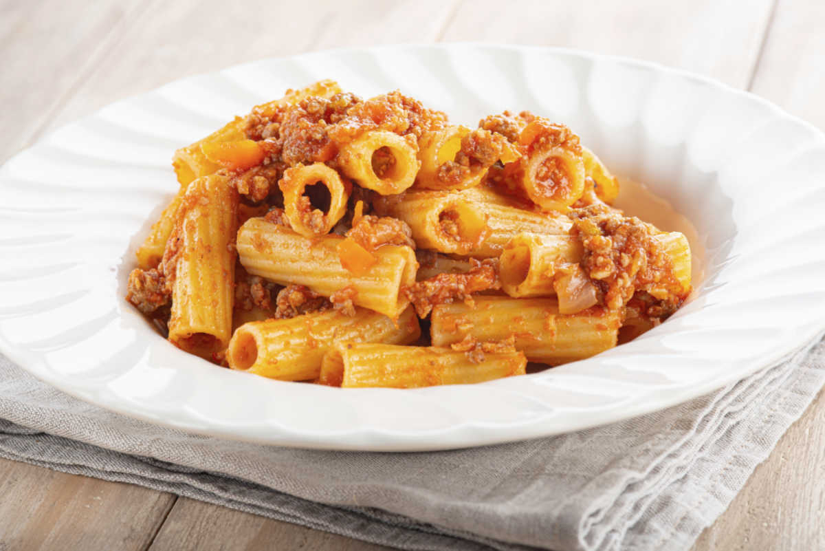Bowl of rigatoni pasta and sauce.