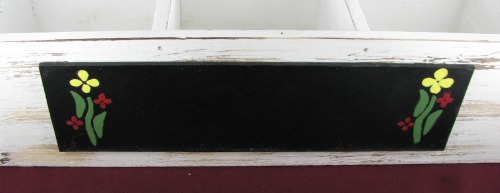Stenciled flowers on a herb garden planter