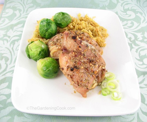 Seasoned baked chicken thighs.