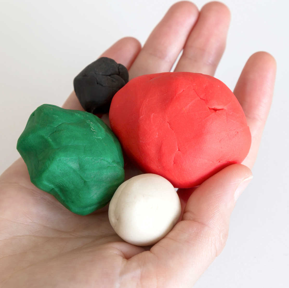 Four balls of colored play dough.