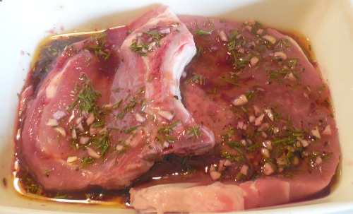 Garlic and rosemary pork chops in marinade