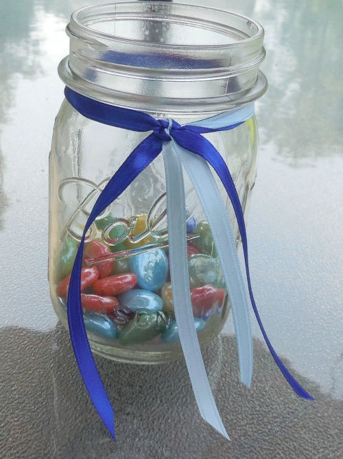 2 colors of ribbon add a decorative touch to the mason jars