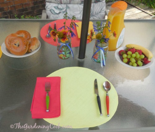 DIY mason jar planters add a nice touch to a summer brunch table