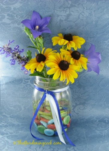 Black eyed susan, mealy cup sage and moon flower make a nice mason jar vase.