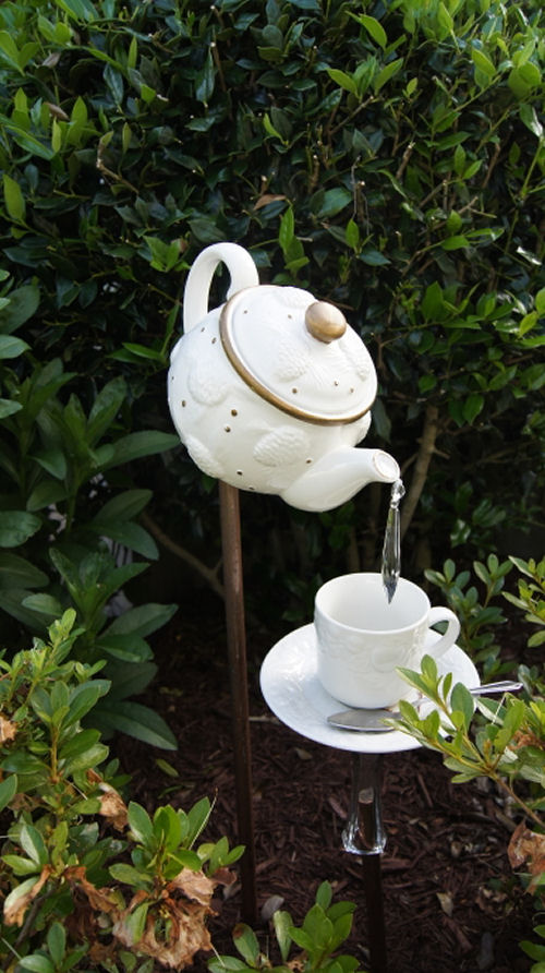 Cute tea pot garden art.