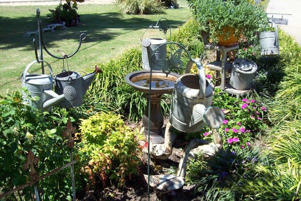 Hanging garden of watering cans