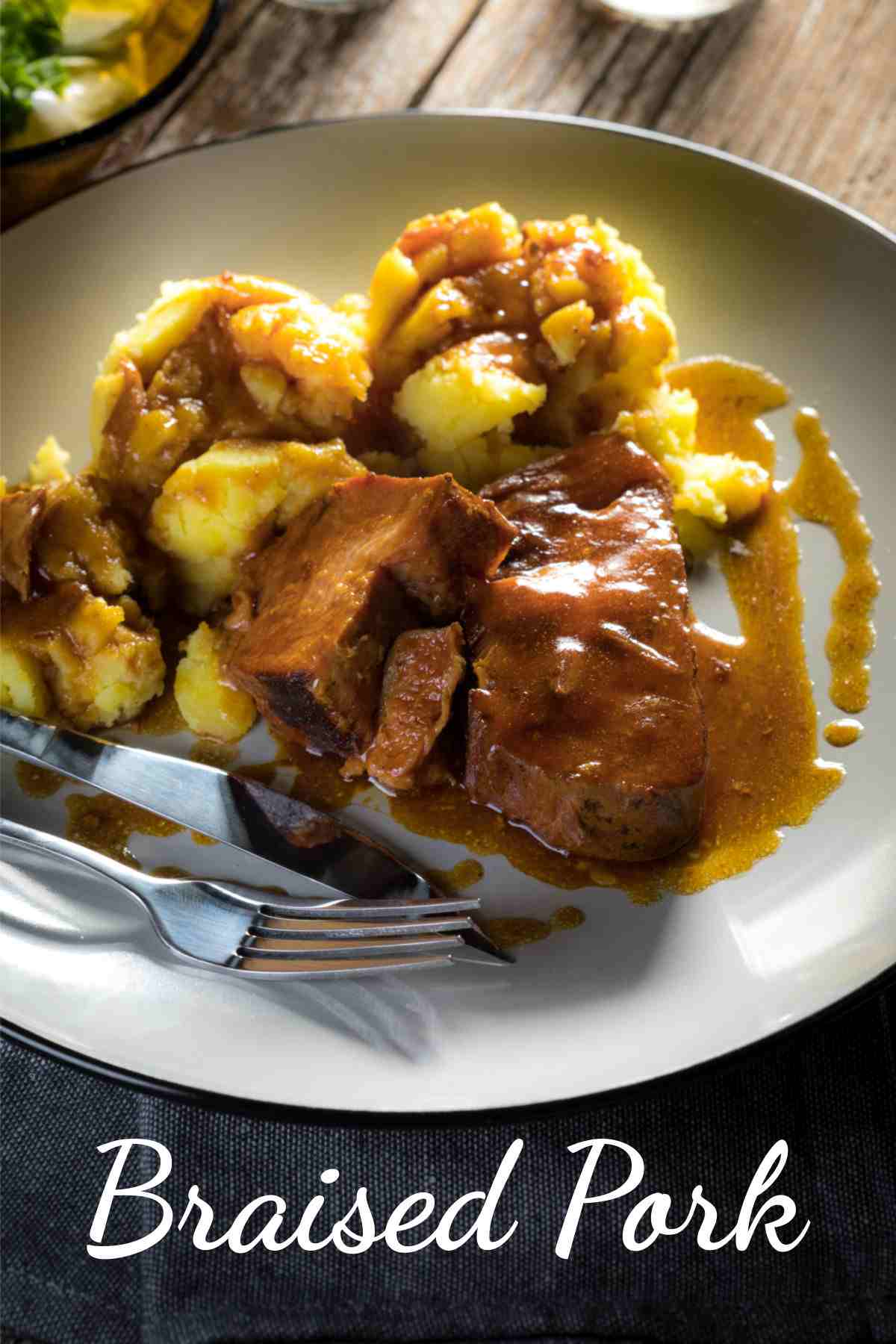 Pork, gravy and potatoes with words braised pork.