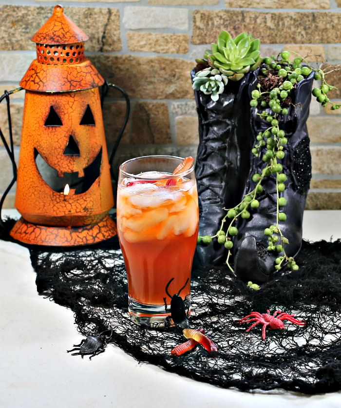 Witches brew cocktail, witch shoe planter and pumpkin lantern