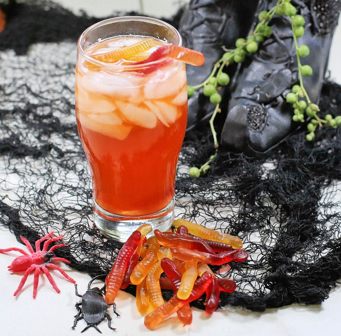 Witches brew cocktail and gummy worms